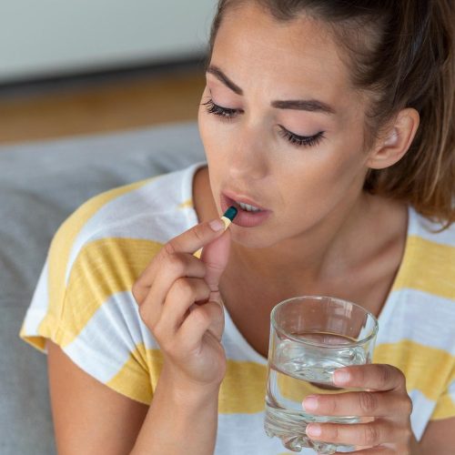 woman-takes-medicines-with-glass-water-daily-norm-vitamins-effective-drugs-modern-pharmacy-body-mental-health-concept